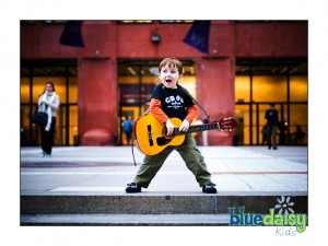 Rock and roll kid portrait with guitar