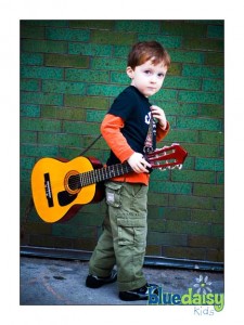 CBGB kid portraits with his guitar