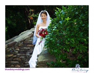 bride hiding behind bushes