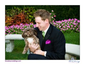 groom with puppy dog