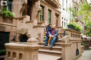 couple sitting at brownstone in New York City
