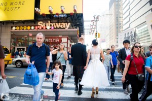 wedding couple walking through Times Square NYC