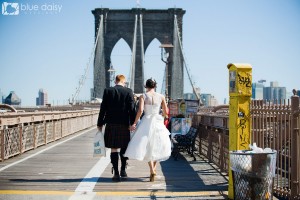 wedding couple walking on the Brooklyn Bridge NYC
