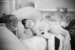newborn baby girl sleeping with mom