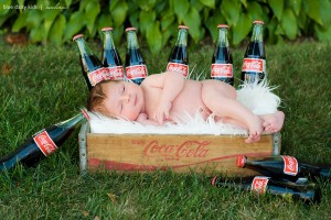 newborn baby girl with vintage coca cola