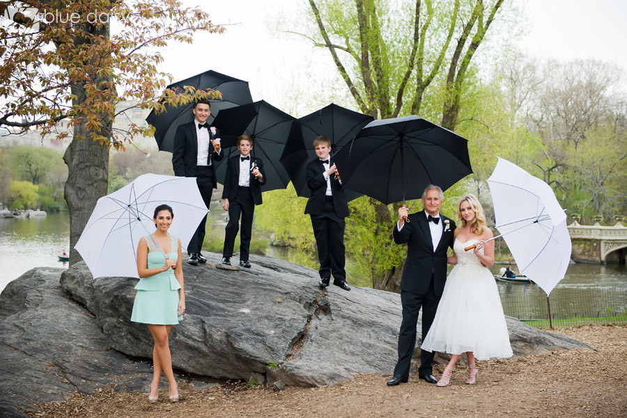 wedding party with umbrellas in Central Park