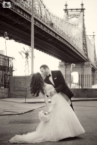 bride and groom under the bridge