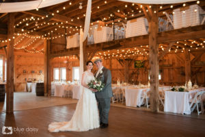 bride and groom inside farm house barn wedding reception