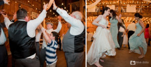 bride and groom dancing with guests